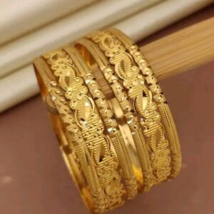 Stylish gold-toned bangles with a modern geometric pattern