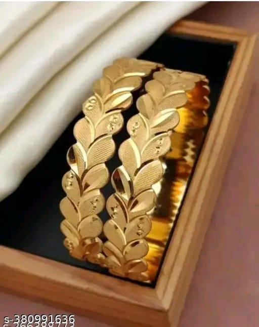 Stunning gold-toned bangles with a bold leaf motif design.