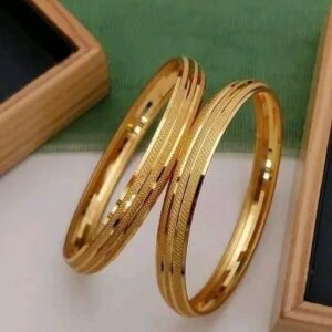 Elegant gold-toned bangles with a sleek, modern design