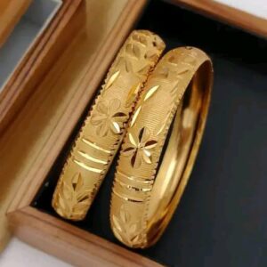 Elegant gold-toned bangles with a sleek, modern design