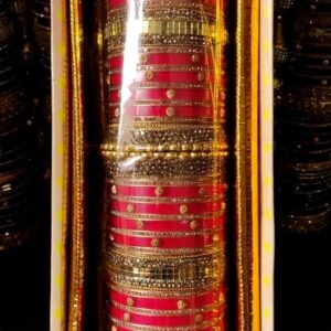 Includes a combination of sleek red bangles and intricately designed golden kadas. | Chudi