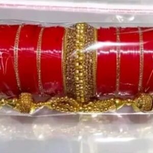 Includes a combination of sleek red bangles and intricately designed golden kadas. | Chudi