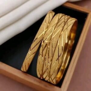 Stylish gold-toned bangles with a modern geometric pattern