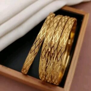 Stylish gold-toned bangles with a modern geometric pattern